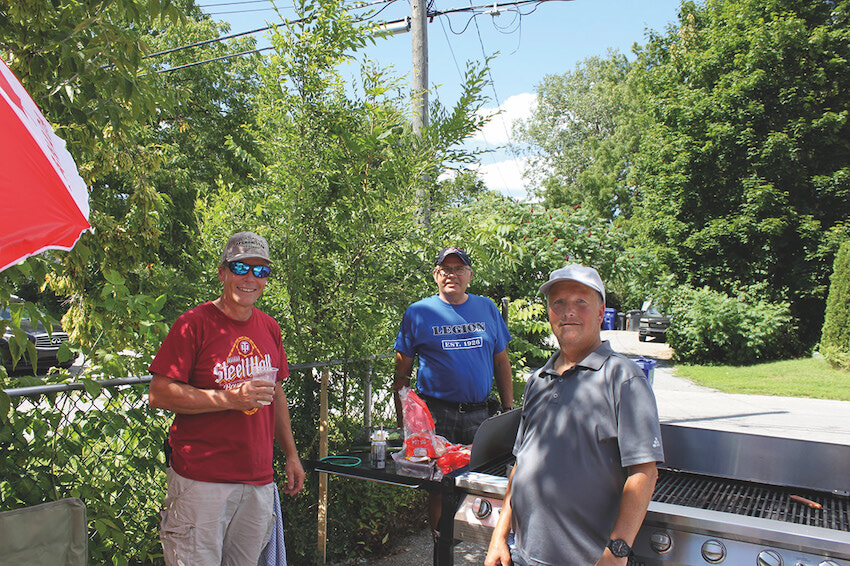 Volunteer cooks at the barbecue Photo credit: Greg Newing